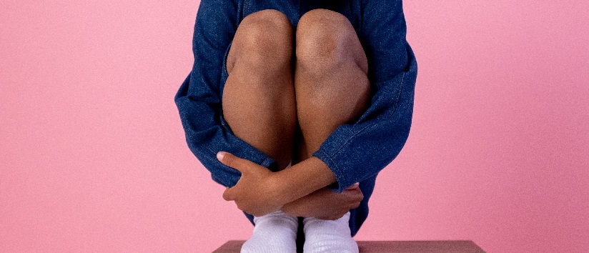 girl crouching, female genital mutilation, FGM