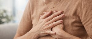 Woman clutching her chest