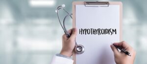 Doctor holding clipboard saying hypothyroidism