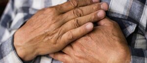 man with hands over heart, heart failure, heart disease, cardiovascular disease, CVD