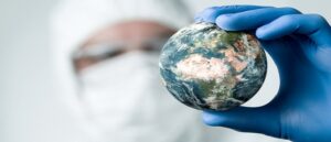doctor looking at globe, climate change, global warming