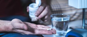 Patient taking a pill