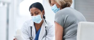 Doctor discussing menopause with female patient
