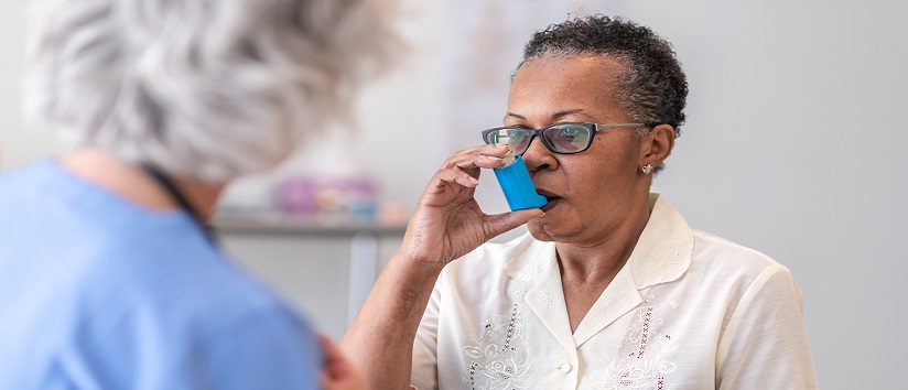 Lady with COPD using inhaler
