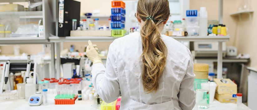 Scientist undertaking clinical trial in laboratory