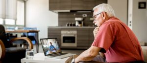 Older man having online therapy