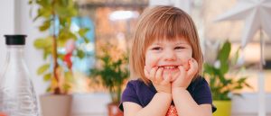 Child sitting at table