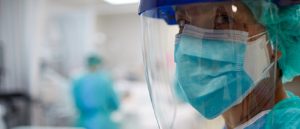 Doctor wearing PPE, doctor from a minority ethnic background